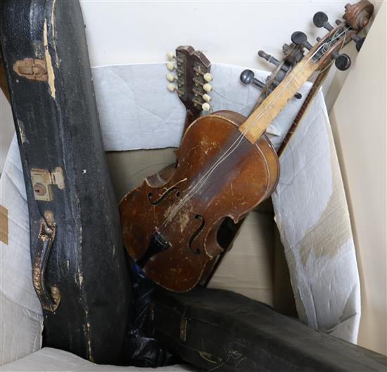 A collection of violins and accessories